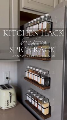 the kitchen has spice racks on the wall