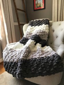 a couch with a blanket on top of it