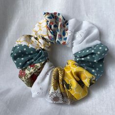 The perfect accessory for every outfit Handmade patchwork scrunchie made from a mix of 100% cotton fabric with strong elastic. Fun, colourful and sustainably made using scrap fabric. Scrunchie measures - 13cm Fabric Pieces Ideas, Scrap Fabric Earrings, Scrap Fabric Sewing Projects, Creative Scrunchie Ideas, Scrunchies Stitching, Unique Scrunchie Ideas, Best Fabric For Scrunchies, Fabric Scraps Ideas, Sewing Projects Scrunchie