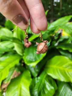 A pair of handmade earrings with two acorns, one is shaped into a teapot and the other a tea cup. The kind of tea set fairies might use. Tea Cup Earrings, Fairy Earrings, Cute Sets, Daughter Love, Ear Wire, Handmade Earrings, Tea Set, Tea Cup, Beautiful Earrings