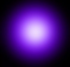 an image of a purple light that is very bright and blurry in the dark