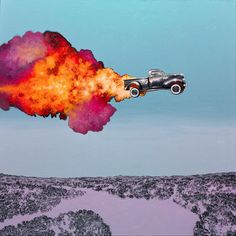 an old car flying through the air with fire coming out of it