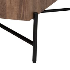 a wooden table with black metal legs