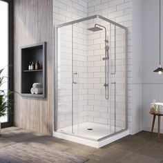 a bathroom with a walk in shower next to a potted plant on the floor