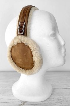 Stylish real sheepskin and shearling earmuffs by UGG. Will be a great accessory for fall, winter or spring on those cold and windy days. The earmuffs have some sings of use and is a bit dirty due to the wear (please see photos closely), otherwise - in good vintage condition. Size (measured on the inside): 17.7" (45 cm) Tag: UGG, made in China More from Vintage Finds: https://www.etsy.com/shop/somethingmustbehere We also make linen, knit and crochet items: https://www.etsy.com/shop/ActLikeACharm Winter Earmuffs Aesthetic, Ugg Headphone Earmuffs, Wool Earmuffs, Cute Winter Earmuffs, Brown Earmuffs, Heart Shaped Earmuffs, Ugg Earmuffs, Classic Fall Style, Fall Fashion Accessories