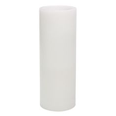 a white vase sitting on top of a table