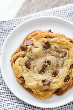 a chocolate chip cookie on a white plate