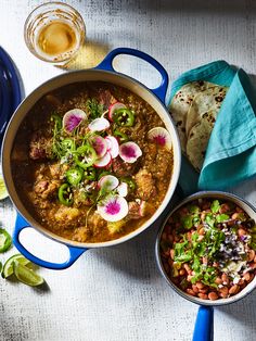 a blue pot filled with food on top of a table