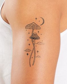 a woman with a mushroom tattoo on her arm