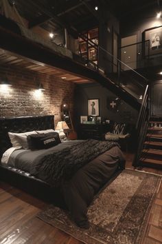 a large bed sitting in the middle of a bedroom next to a stair case and wooden floors