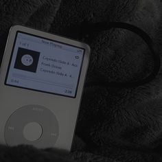 an ipod sitting on top of a blanket