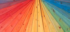 an image of rainbow colored wood planks