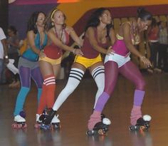 three women are rollerblading on the floor in tights and leggings