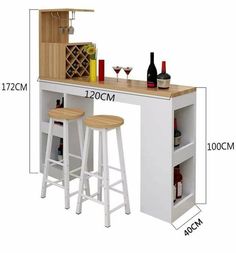 an image of a bar set with stools and wine bottles on the counter top