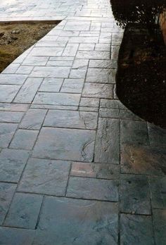 a stone walkway with water running down it