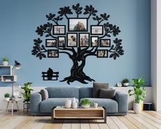 a family tree with pictures hanging on the wall