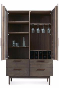 a wooden cabinet with wine glasses on it