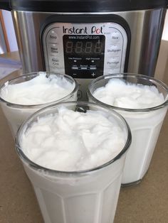 three glasses of milk in front of an instant pot