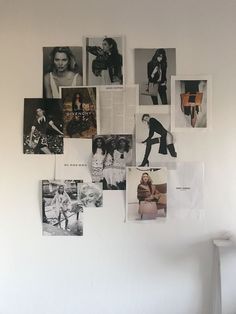 a white wall with many pictures hanging on it