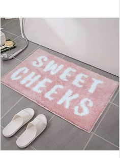 a bathroom rug with the words sweet chicks on it and slippers next to it