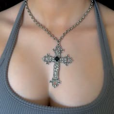 This Gothic Cross Necklace includes a Silver Big Cross Pendant making it a perfect vintage grunge jewelry gift for her. Featuring a statement black rhinestone on the center of the cross pendant, it blends religious jewelry elements with bold, edgy style. 𝐃𝐄𝐓𝐀𝐈𝐋𝐒:  ⭐️ Necklace lengths available: 14" 16" 18"  ⭐️ Big cross pendant size is 3" ⭐️ The large silver cross pendant is silver plated over metal. The chain necklace is made up of a high quality stainless steel, safe for those with sens Vintage Metal Crucifix Cross Necklace, Vintage Metal Cross Necklace, Grunge Cross Jewelry For Gift, Vintage Cross Shaped Metal Jewelry, Vintage Cross-shaped Metal Jewelry, Vintage Black Cross Necklace, Big Cross Necklace, Big Silver Necklace, Large Cross Necklace