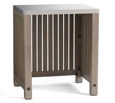 the side table is made out of wood and has metal bars on each side, along with