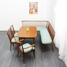 a dinning room table with four chairs around it