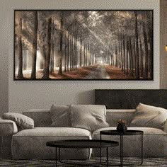 a living room filled with furniture and a painting on the wall