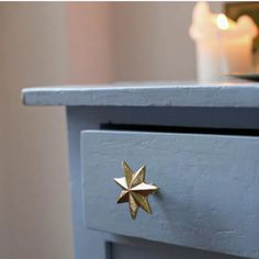 a close up of a drawer with a star decoration on the front and bottom part