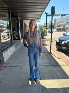 Rock a stylish and versatile look with the Carris Blouse! Designed to pair perfectly with your favorite denim for a casual outing, or elevate your office attire effortlessly. This blouse is a must-have for any wardrobe. Get ready to turn heads and feel confident wherever you go! Casual Medium Wash Blouse, Trendy Dark Wash Denim Blouse, Trendy Denim Blouse For Day Out, Versatile Jeans For Day Out, Casual Button-up Jeans For Work, Chic Medium Wash Tops For Everyday, Chic Everyday Medium Wash Tops, Trendy Light Wash Blouse For Day Out, Versatile Jeans For Fall Day Out