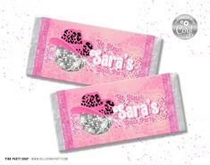 two pink candy bar wrappers with black and white designs