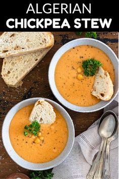 two bowls of soup with bread on the side