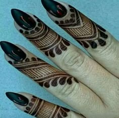 a woman's hand with black and white designs on it