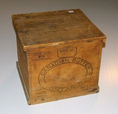 an old wooden box with canadian butter on it