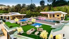 an aerial view of a house and pool