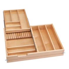 an open wooden box with compartments on the inside