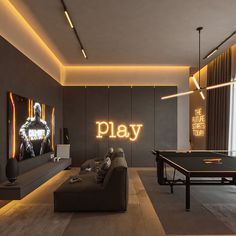 a living room filled with furniture and a ping pong table