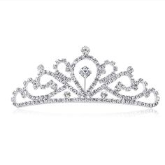 PRICES MAY VARY. As a princess tiara comb, it's brilliant with silver plated metal bend Measured 4.3*4*1.6 inches, great for girls and kids The tiara for women is Light, do not bring a headache. And it also has a comb to hold in place Amazing quality of workmanship of the tiara, is very sturdy and well made It's dainty, fancy gift for birthday, wedding, prom, party This product is a charming and shiny tiara, the adoption of silver plating technology and rhinestone material gives it diamond look Princess Party Costume, Rhinestone Material, Birthday Princess, Rhinestone Tiara, Princess Tiara, Tiara Crown, Fancy Gifts, Crown Headband, Rhinestone Wedding