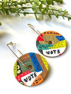 Standout from the crowd and encourage others to vote in these bold, unique statement earrings. Polymer earrings are lightweight and comfortable enough to wear all day. A fun look to have in your jewelry collection. Completely handmade and one of a kind. Materials: Polymer Earring hoop: Gold plated brass Dimensions: Approximately 3" L x 2" W Exactly as pictured and ready to ship. Care: Please keep away from oils, lotions, and perfumes. Do not wear in water. Take care when handling these pieces: they are built sturdily with the highest quality clay, but clay is not unbreakable. The colors displayed may be slightly different due to your monitor's color calibration and resolution settings. Every attempt has been made to represent the product and features as accurately as possible. Thank you fo Bright Earrings, Earrings Edgy, Edgy Earrings, Earring Hoop, Wearable Art Jewelry, Earrings Polymer, Polymer Earrings, Earrings Clay, Paper Jewelry