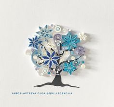 a blue and white tree with flowers in it's center on a white background