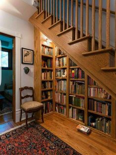 the stairs are made of wood and have bookshelves