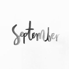 the word september written in black ink