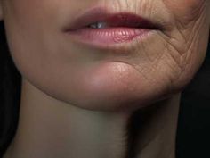 an older woman's face with wrinkles on the upper part of her lip