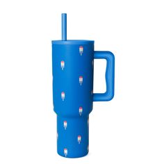 a blue travel mug with toothpicks on it and a straw sticking out of the cup