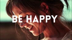 a woman smiling with the words be happy in front of her face and behind her ear