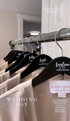 wedding dresses hanging on hangers in front of a door with the words, bride's day written on them