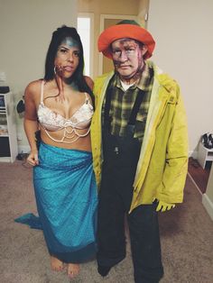 a man and woman dressed up in costumes