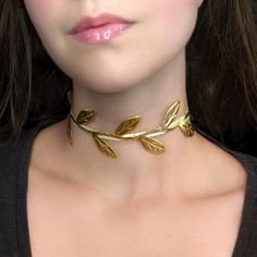 "A gold leafy vine choker fit for a forest elf! This necklace features metallic cutout ribbon, cream satin picot ribbon backing and your choice of bronze or gold hardware. The length shown in photos is 12\" and more options are available. Each size comes with an additional 2.5\" extender chain. When selecting necklace length, measure around the smallest part of your neck. If you're in between sizes, go for the next smallest size and use the extender chain for the perfect fit! If you would like a custom size, send me a message and I can make it for you :) Jewelry Care Tips For a Long, Happy Life Together <3 * Store your jewelry in an air-tight container to avoid metal parts becoming tarnished or oxidized * Remove Jewelry before exercise or swimming * Avoid direct contact with perfume, alcoh Elf Fairy Costume, Loki Halloween Costume, Fairycore Jewelry, Elf Jewelry, Vine Necklace, Vine Jewelry, Elf Fairy, Avengers Outfits, World Necklace