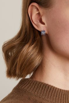 From Piaget's signature 'Possession' collection, this earring is inspired by elegance and a playful spirit. Cast from 18-karat white gold, it's set with three rows of stunning blue sapphires and centered with a single sparkling brilliant-cut diamond. Wear yours as a pair or mix and match with other pieces from the collection. Piaget Possession, White Gold Sapphire, Single Earring, White Sapphire, Brilliant Cut Diamond, The Collection, Ear Piercings, Blue Sapphire, Luxury Design