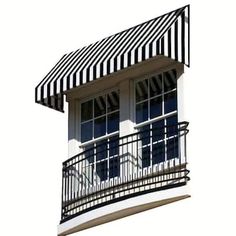 a black and white striped awning over a balcony